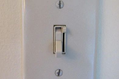 Dimmer/Switch on white wall