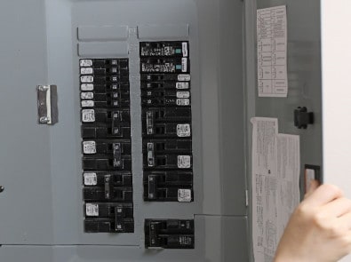 Panel being inspected by an electrician