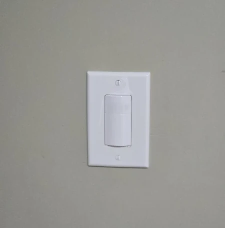 Kasa smart motion sensor light switch Installed on grey wall by The Power Doctor